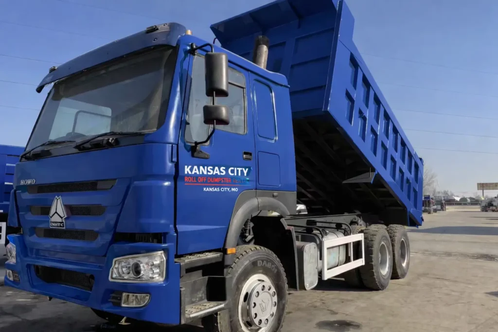 blue roll off dumpster truck delivering dumpster rental in Kansas City MO residential construction waste removal